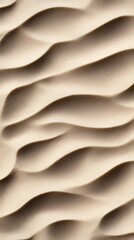 Obraz premium A close up of a sand dune with wavy lines on it