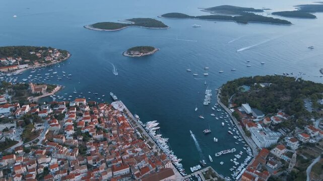 Aerial: Flying over Hvar island in Croatia. Shot in Mediterranean coastline.