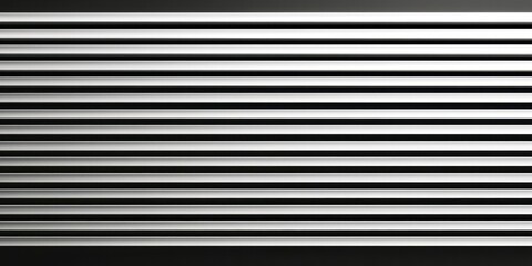 Black and white photo of a metal surface with many lines