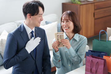 査定する中古出張買取業者と客