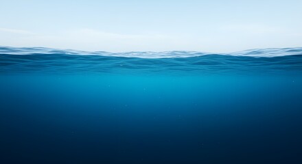 An underwater scene, featuring a light blue hue at the top that gradually changes to a deep dark blue at the bottom. The water is clear, with soft, creating a calm and deep oceanic atmosphere.