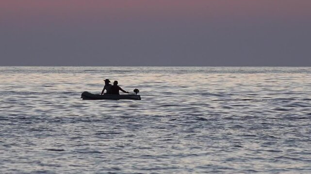 Fishermen in Boat on Sea at Sunset, Fishing in Ocean at Sundown, Isolated Ship in Waves