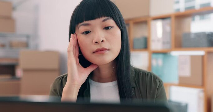 Laptop, logistics and stress with Asian woman in office for management of delivery or distribution schedule. Box, computer and ecommerce with employee in supply chain depot for backlog or delay
