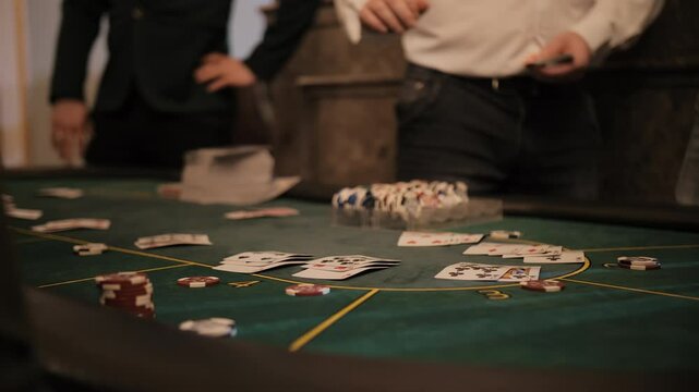 Dealer distributing cards at a casino table
