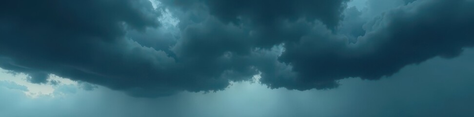Obraz premium Dark grey storm clouds gather, heavy with rain , graphical, atmospheric