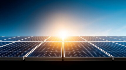 Bright Sunrise Over Solar Panels Against Clear Blue Sky