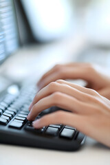 A person typing on a keyboard with a computer code and software engineering concept background