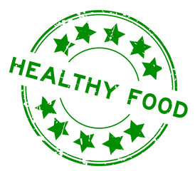 Grunge green healthy food word with star icon round rubber seal stamp on white background