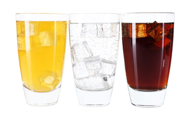 Soda water of different flavors with ice cubes in glasses isolated on white
