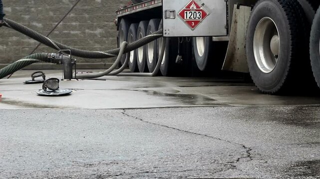 gas station filling petrol from gas truck cargo