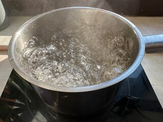 boiling hot water on the stove