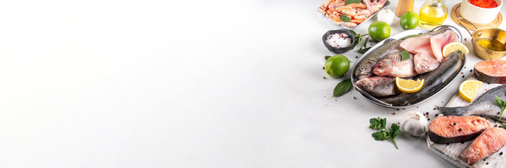 Variety raw fish and seafood background. Fresh fish, shrimps, mussels, caviar assortment flat lay, fish sale and market template