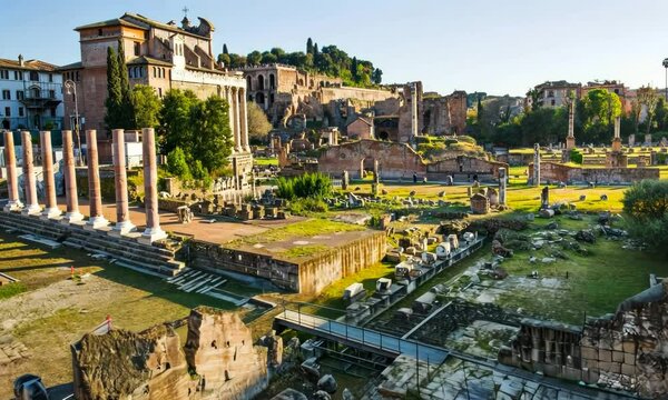 Rome Forum, camera flying  abate the ancient archaeological site with temples and administrative buildings ruins 