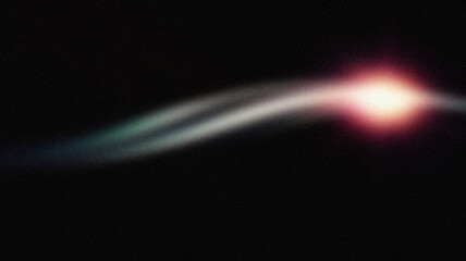 A glowing light streak with a bright flare on a dark background. Perfect for futuristic wallpapers and cosmic designs.