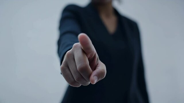 Person Hand Pointing with Authority and Focus in Business Context
