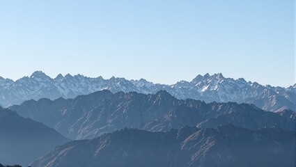 Serene sunrise over majestic mountain range bathed in golden light perfect for inspirational concepts