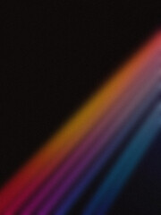 Soft diagonal light streaks in red, orange, purple, and blue on a dark background. Perfect for wallpapers and creative designs