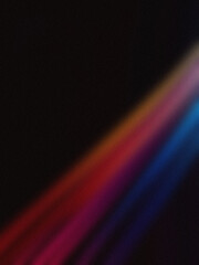 Vibrant diagonal light streaks in red, orange, and blue on a dark background. Perfect for wallpapers and modern designs.