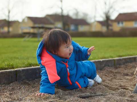 little baby playing in the park