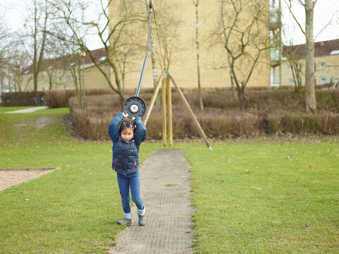 little girl playing in the playground