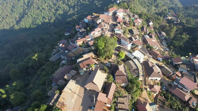 Aerial view from drone of the rural village with car and mountain road