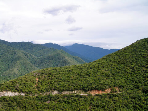 Stunning landscape of Maracay, Venezuela showcasing lush green mountains under a cloudy sky