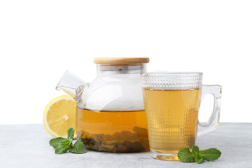 Aromatic mint tea, fresh leaves and lemon on light gray table against white background