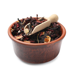 Dried tea leaves and scoop in bowl isolated on white