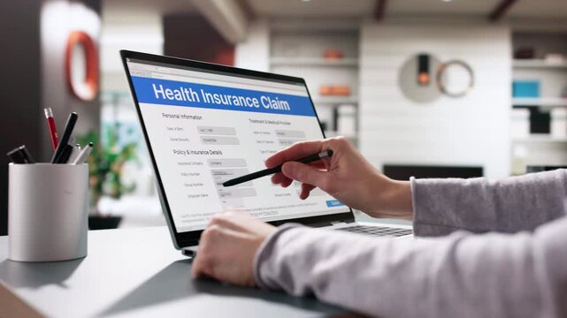 Close-up Of Person Hand Over Medical Benefits Claim