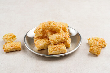 Crunchy pastry cookies with almond sprinkles 
