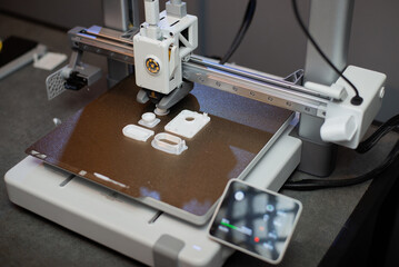 3D printer prints small parts. Prototyping concept