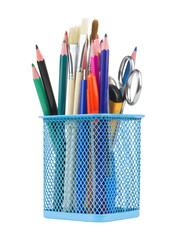 Colored pencils and various school supplies in a metal holder or cup. Isolated from the background	