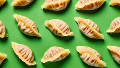 seamless pattern of fresh Chinese dumplings on a green background