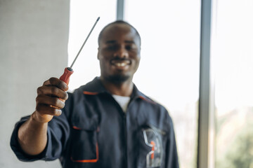 Repairman is indoors in the modern office