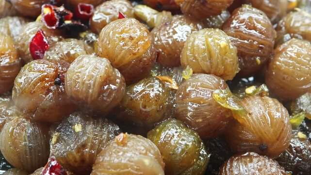 Amla or Gooseberry pickle close up. Bowl of amla recipe. 

