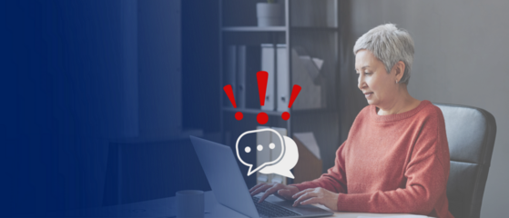 senior lady working on her laptop; chat symbols layer with red question marks on her computer; concept online threats like credit card fraud, cyberthieving for older people; copy space