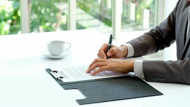 Indoors Closeup unknown person signing document with pen. buy insurance, Mock-up "Lorem Ipsum" Signature Made on the Template Document. Close up