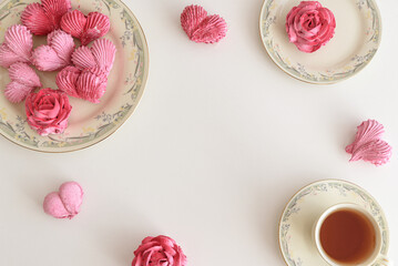 Romantic Tea Party with rose and heart shape marshmallow. Valentine's Day celebration. Flat lay