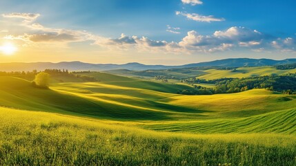 Obraz premium Stunning panoramic view of a picturesque countryside landscape featuring rolling green hills, vibrant meadows and majestic mountain backdrop