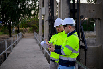 Fototapeta premium Structural engineers and technicians are inspecting the structural standards of the dam's floodgates.