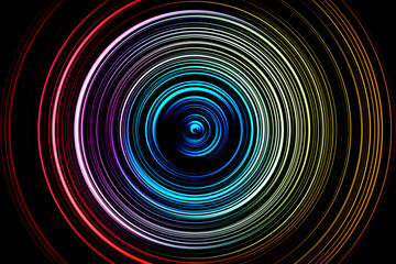 Abstract radial motion blur in blue, lilac, red, orange tones on black background. Circle glowing pattern for label, textiles, garment or brochure design. 