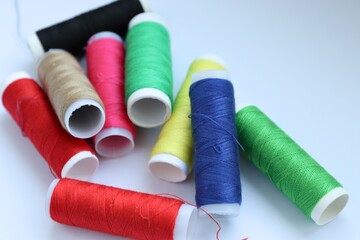 spools of thread, needlework, colored thread, spools of thread on a white background, 