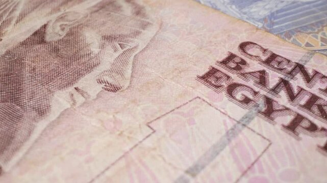 Close-up shot of an Egyptian 10-pound banknote with a sliding motion.