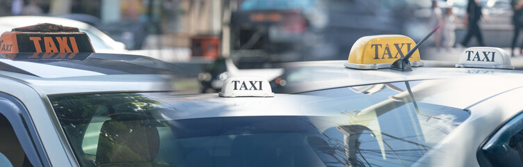 Taxi in the city street at summer.