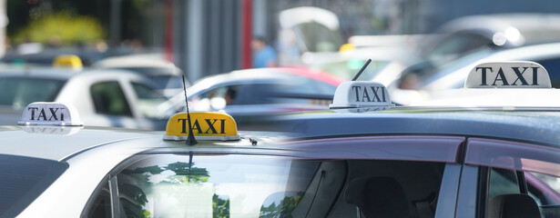 Taxi in the city street at summer.