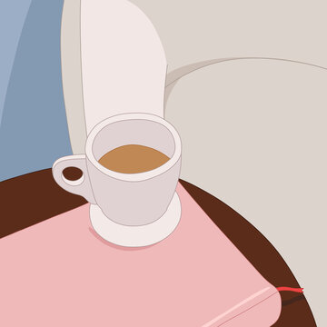 Warm Coffee Cup on a Book by the Sofa