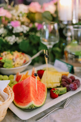 Sweet snacks for wedding guests, wedding hall wedding day, table with sweets and cakes