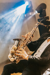 Man plays saxophone, classical jezz music, concert