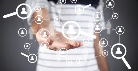 Human resource management concept with magnifying glass.