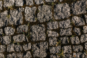 Road made of granite paving stones 